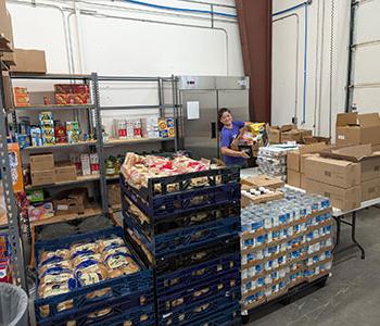 Student Resource Center at San Juan College putting together food boxes for students.